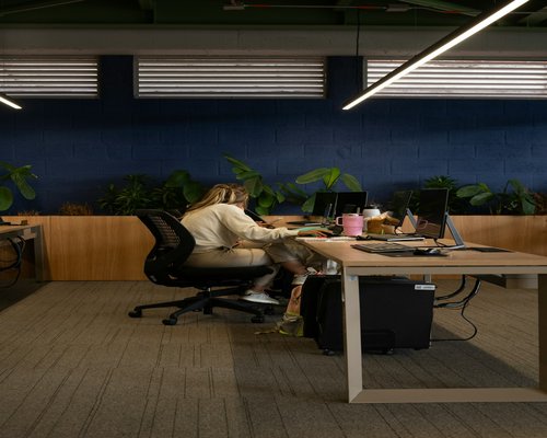 Colleagues taking a small break at office desk