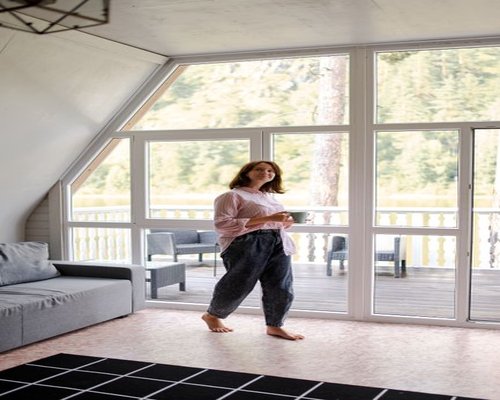 Woman enjoying a peaceful morning with coffee by the window
